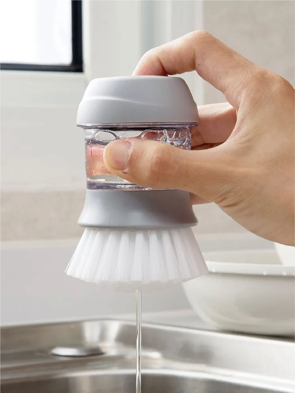 Cepillo dispensador de jabón